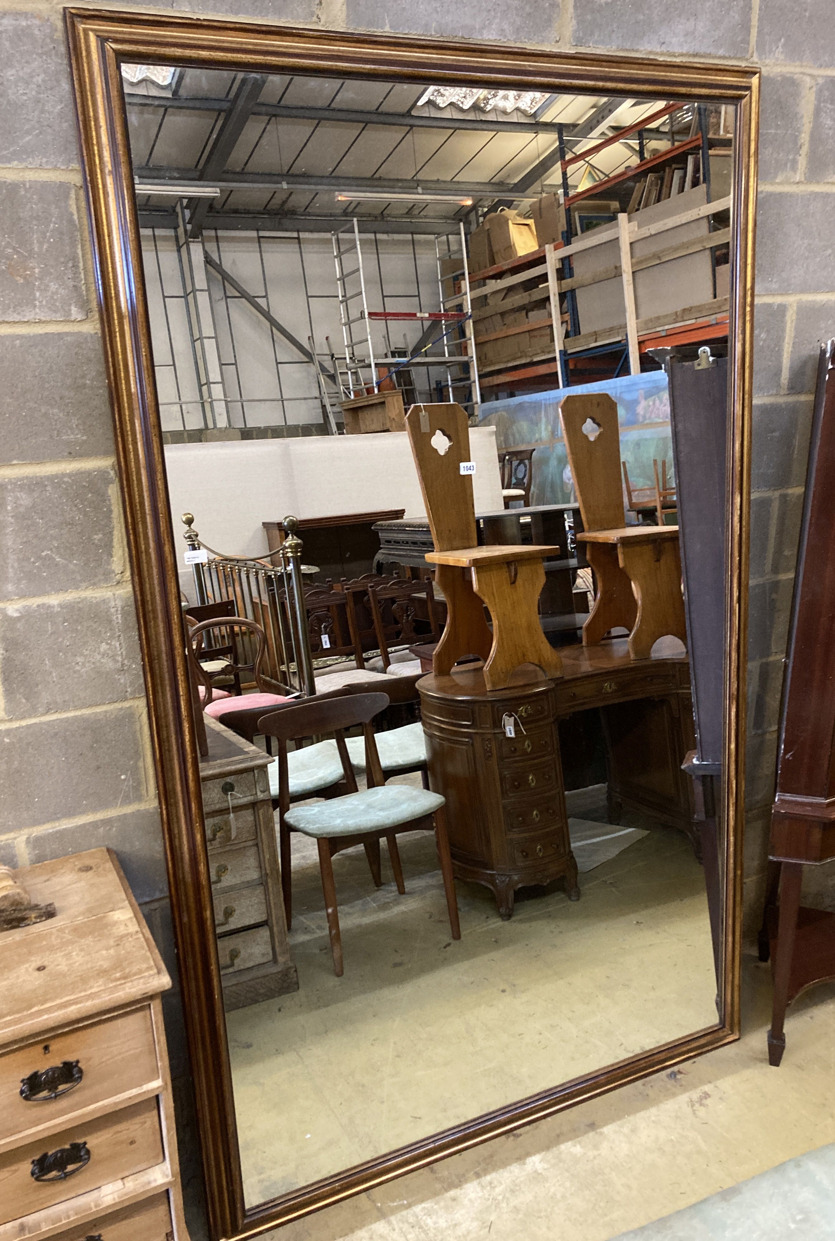 A large rectangular parcel gilt-framed wall mirror, width 140cm, height 230cm